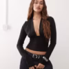 Weekday deep halter neck long sleeve top in black exclusive to ASOS